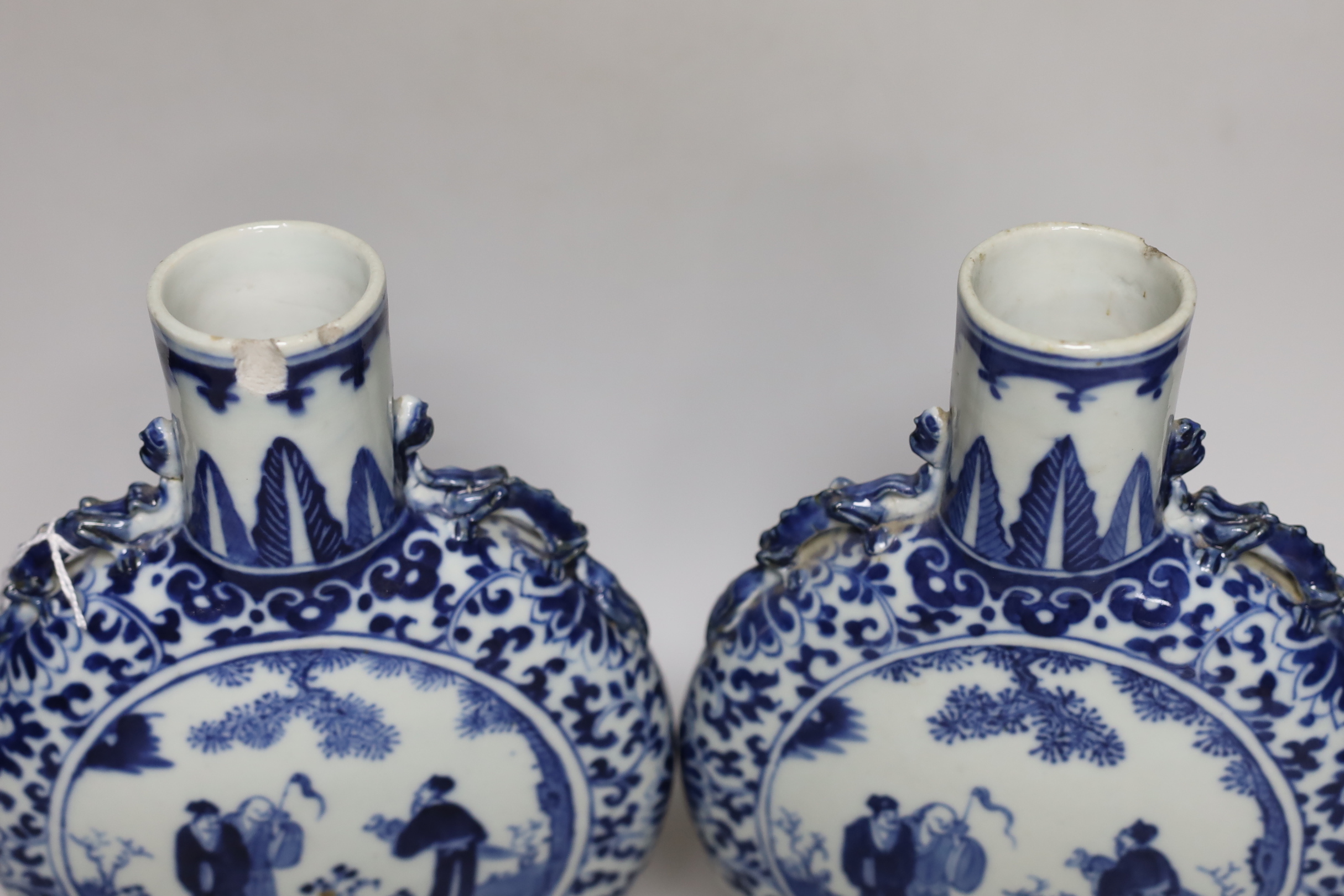 A pair of 19th century Chinese blue and white moonflasks, 26cm high